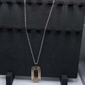 Elegant Gold and Silver Pendant Necklace